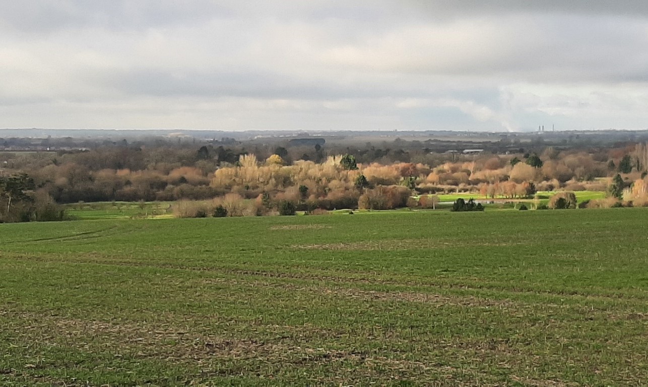 Large arable fields look over wooded blocks, with long views (near North Stoke)