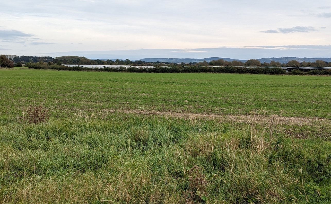 Solar farm off Windmill Road with views to the wooded Chiltern hills beyond