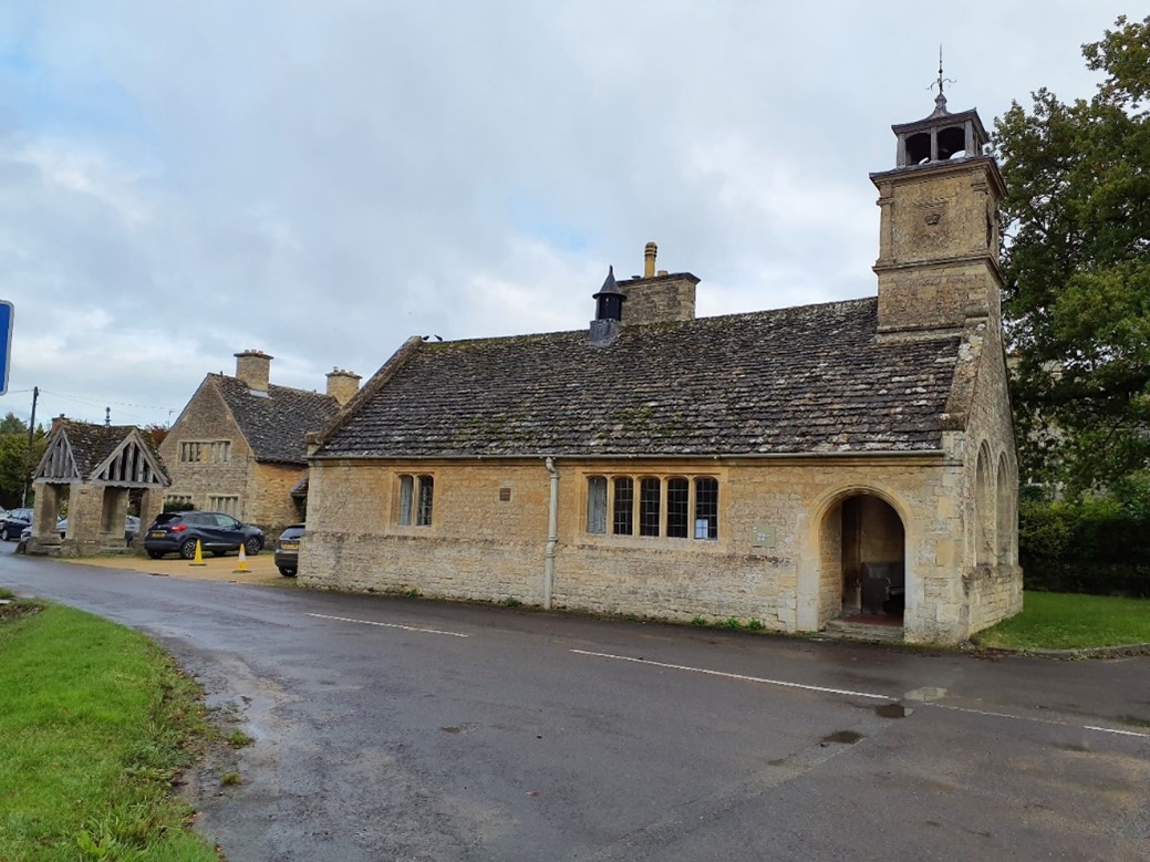 The Grade II Listed village hall, well and cottages in Buscot Conservation Area