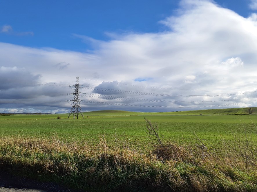 LCA 13D Open fields with electricity pylon and views to wider North Wessex Downs