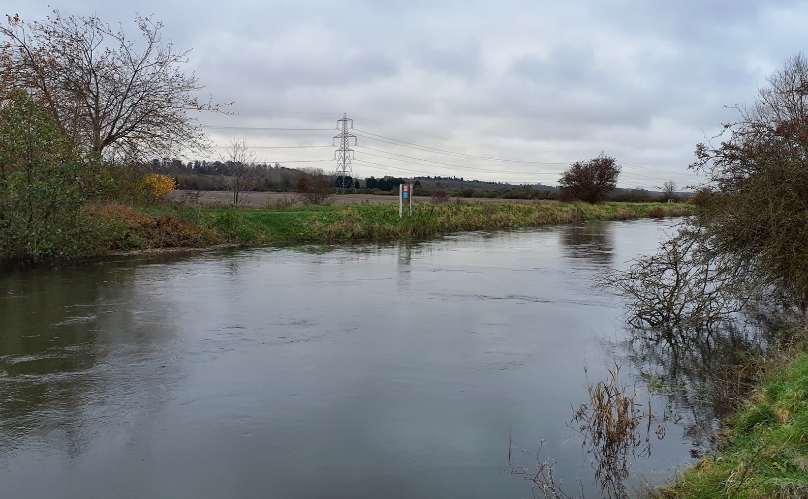 River Thames with wooded ridge on the horizon
